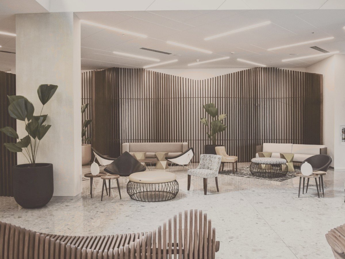 Hotel lounge with fluted wood panelling and warm lighting